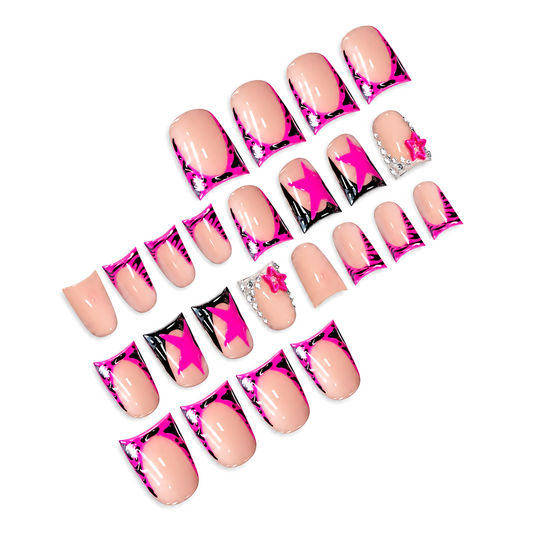 Snazzi Pink Shop Neon Star medium duckbill press-on nails with neon pink French tips, black accents, and star charms.