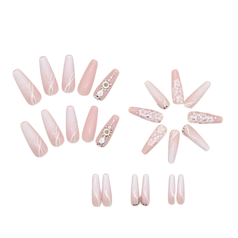 Set of pink nail extensions with rhinestones on a white background. Extra long ombré floral nails with rhinestone accents.