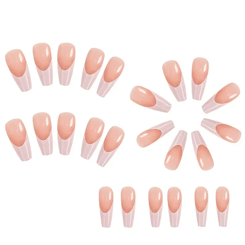 Clean girl glam press-on nails with white tips. Extra long nude and white French tip coffin nails loose on white background.