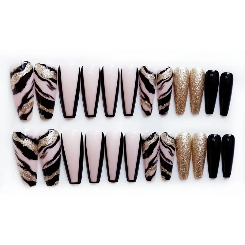Extra long coffin nails with black French tips and gold glitter. Luxury black and gold press-on nails with glam stripe design.