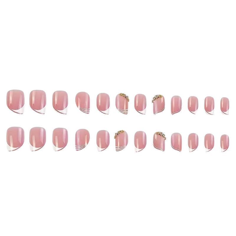 The Glossy Rhinestone Nails by Snazzi Nails offer salon-quality pink nails with varied designs, including French white edges, gold embellishments, and white diagonal lines. Arranged in four rows, these nails feature beautiful variations in size and adornment.
