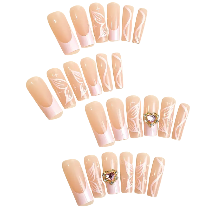 French tip press-on nails with pink swirls and gold accents