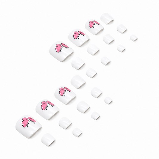 Snazzi Pink Shop pink butterfly press-on toenails with white French tips and a glossy finish on a white background.