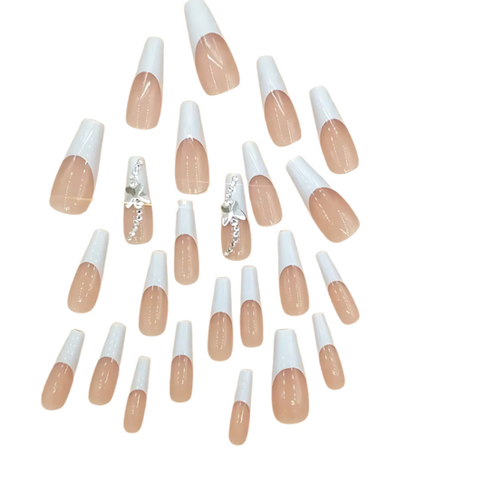 Snazzi Pink Shop Butterfly Frost extra long coffin press-on nails with nude base, white French tips, and crystals.