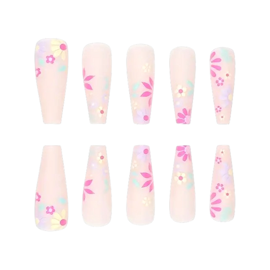 Snazzi Pink Shop extra long coffin press-on nails with pink and yellow floral confetti art on a soft matte base.