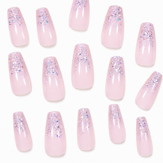 Snazzi Pink Shop long coffin press-on nails with a soft pink base and holographic silver glitter fade effect.
