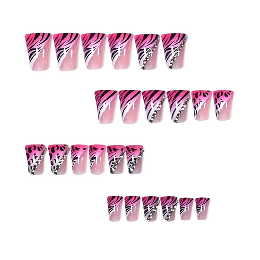 Snazzi Pink Shop Wild Pink medium duckbill press-on nails with hot pink zebra and leopard print and crystal accents.
