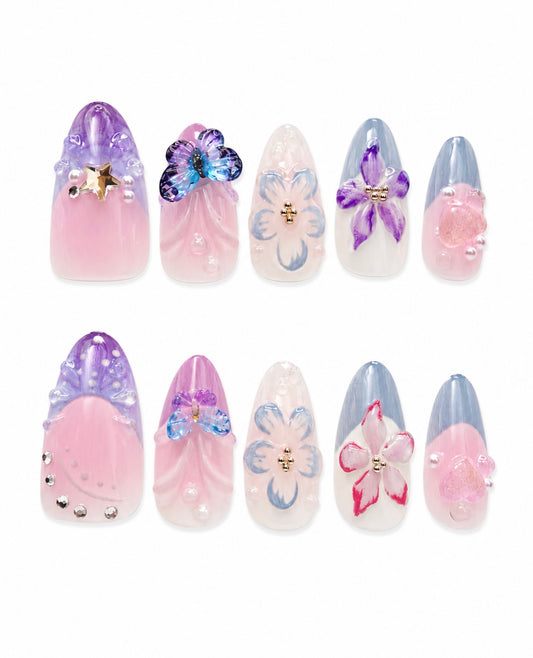 Garden Daydream medium almond handmade nails with pastel flowers, butterflies, pearls and translucent pink, lavender and blue details