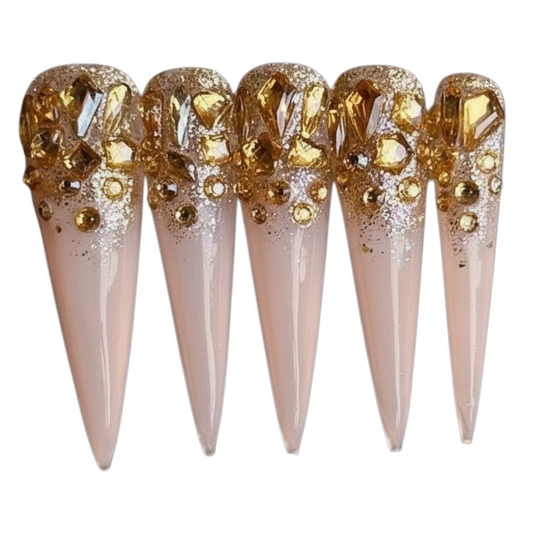 Jeweled Reign 2XL Luxe stiletto handmade nails with amber-gold crystals, glitter and rhinestones.