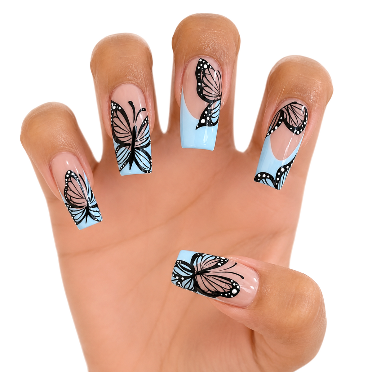Snazzi Pink Shop extra-long coffin press-on nails with nude base, baby-blue French tips, and black butterfly art.