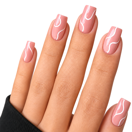 Snazzi Pink Shop Silk Ribbon medium square press-on nails with blush pink base and elegant white swirl design.