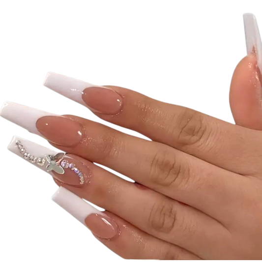 Snazzi Pink Shop extra long coffin press-on nails with nude base, white French tips, silver crystals, and butterfly.