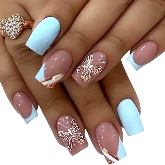 Snazzi Pink Shop Golden Flutter medium square press-on nails with baby blue French tips and rose gold butterfly art.