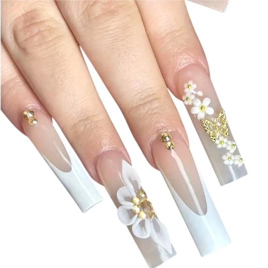 Snazzi Pink Shop extra long coffin press-on nails with white French tips, floral embellishments, and gold butterflies.