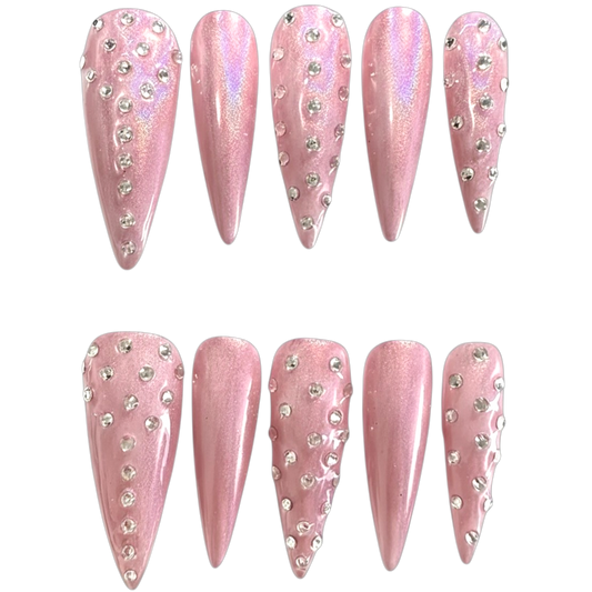 Snazzi Pink Shop Crystal Allure extra long stiletto nails in pearlescent pink with clear rhinestone embellishments.