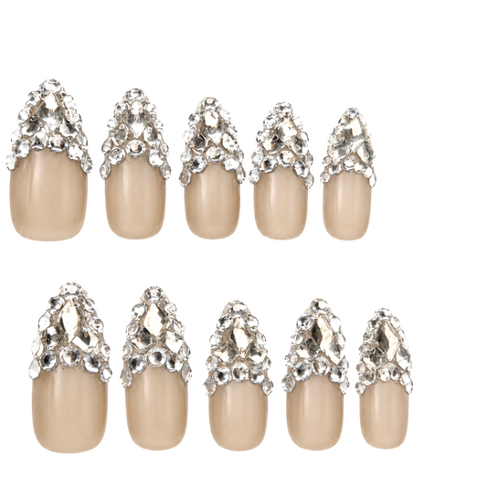 Snazzi Pink Shop Diamond Heiress long almond press-on nails with a neutral taupe base and layered silver crystals.