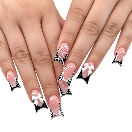 Snazzi Pink Shop Bow Instinct medium duckbill press-on nails with zebra French tips, white line art, and 3D bow charms.