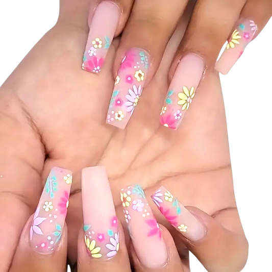 Snazzi Pink Shop extra long coffin press-on nails with pink and yellow floral confetti art on a soft matte base.