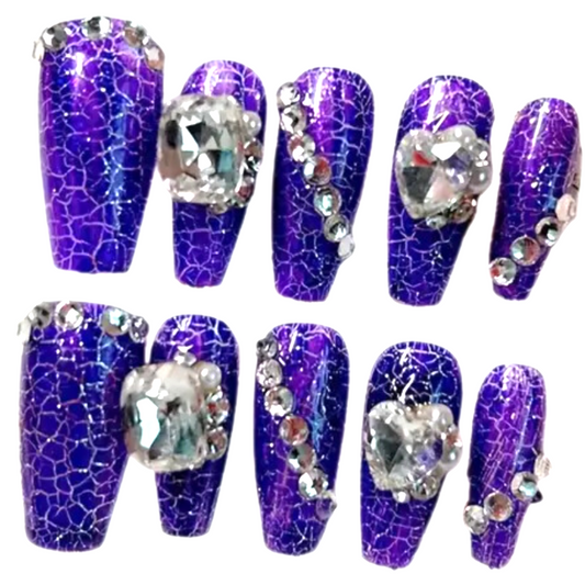 Snazzi Pink Shop Gallery Girl long coffin press-on nails with electric purple and blue crackle and crystal accents.