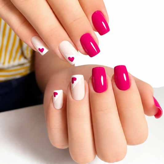 Snazzi Pink Shop medium square press-on nails with glossy pink and nude polish featuring heart accent designs.