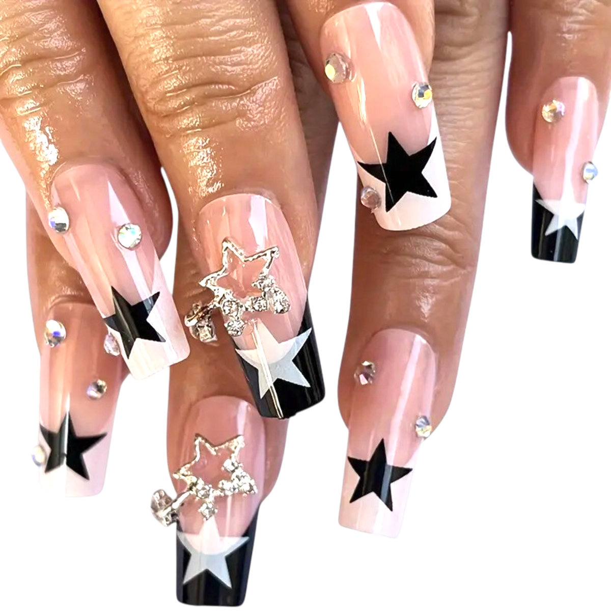 Snazzi Pink Shop long coffin press-on nails with nude base, navy star tips, crystal charms, and iridescent rhinestones