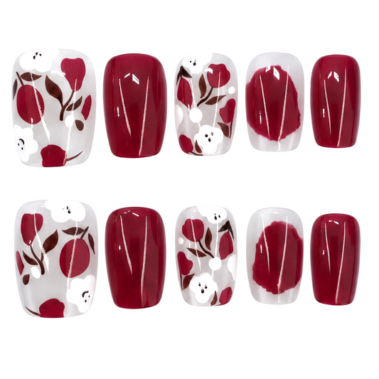 Snazzi Pink Shop Merlot Garden short square press-on nails with burgundy floral art and sheer accent nails.