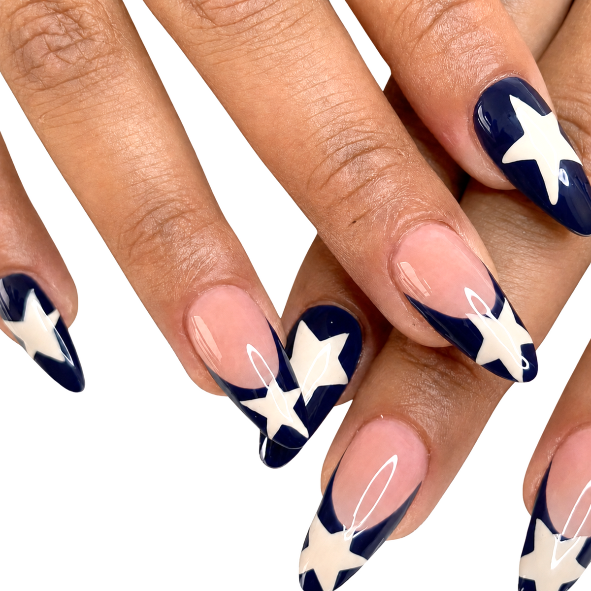 Snazzi Pink Shop Star Player long almond press-on nails with glossy navy blue French tips and white star accents.