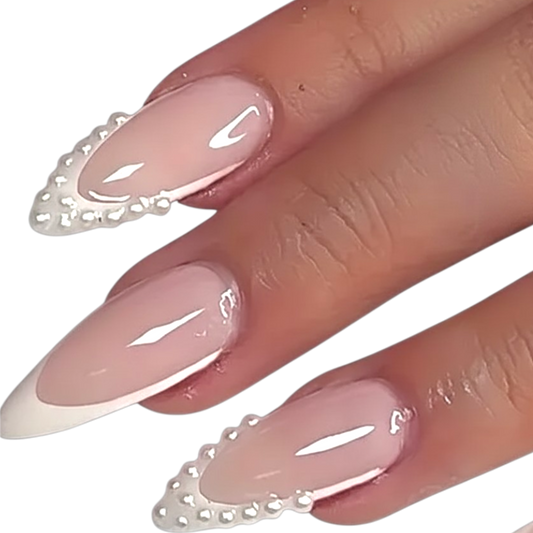 Snazzi Pink Shop long almond press-on nails with white French tips and delicate pearl accents in a bridal style