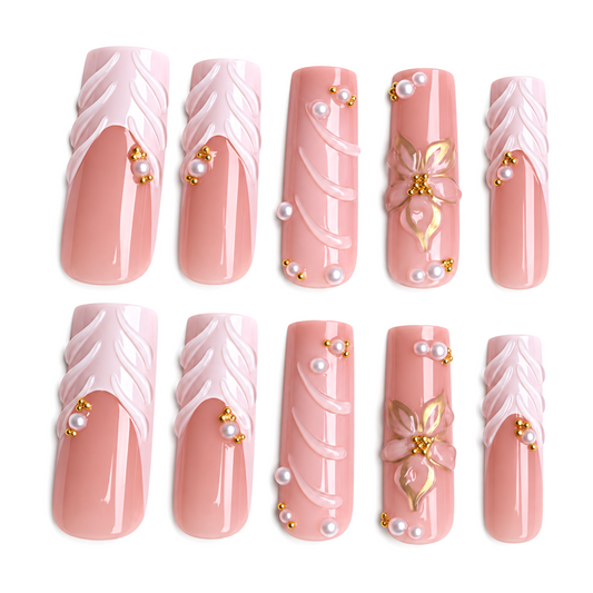 Snazzi Pink Shop Pearl Petals extra long square press-on nails with glossy nude-pink, floral, pearl, and gold accents.