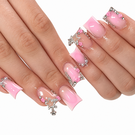 Snazzi Pink Shop Pink Starfall medium duckbill press-on nails with French tips, floral details, and silver star charms