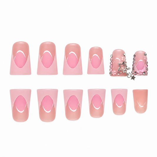 Snazzi Pink Shop Pink Starfall medium duckbill press-on nails with French tips, floral details, and silver star charms.