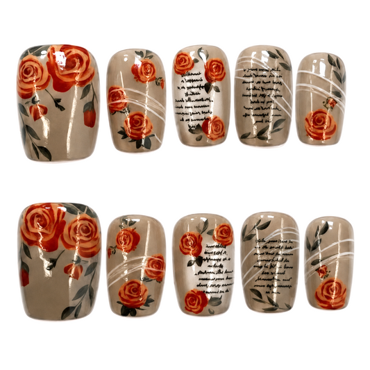 Snazzi Pink Shop short square press-on nails in taupe with red rose art, vintage script, and white line accents.