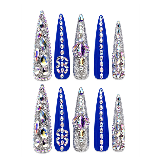 Snazzi Pink Shop Sapphire Dynasty 4XL stiletto nails in royal blue and silver with iridescent crystal embellishments.