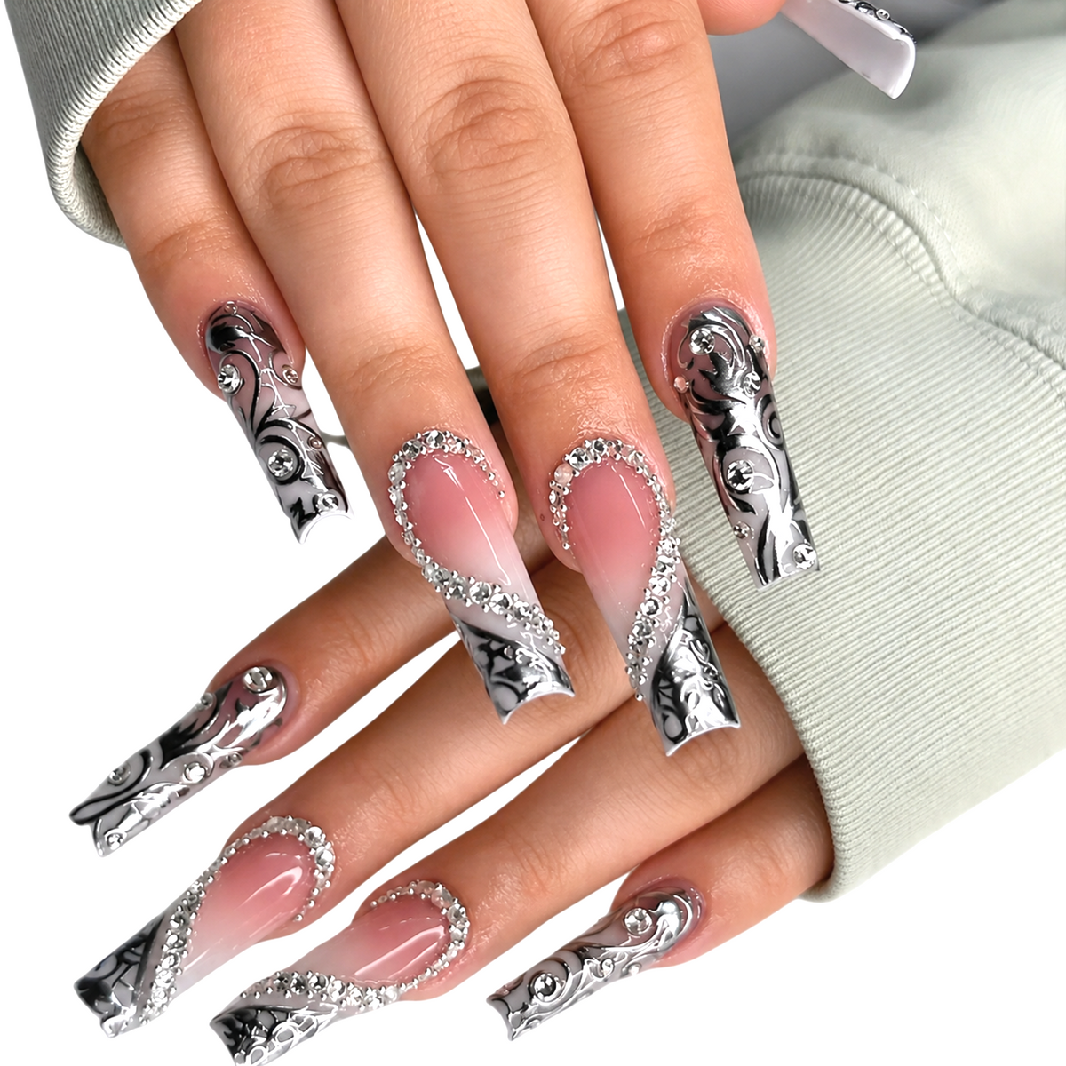 Snazzi Pink Shop extra-long coffin press-on nails with nude-ivory base, metallic silver scrollwork, and crystals.