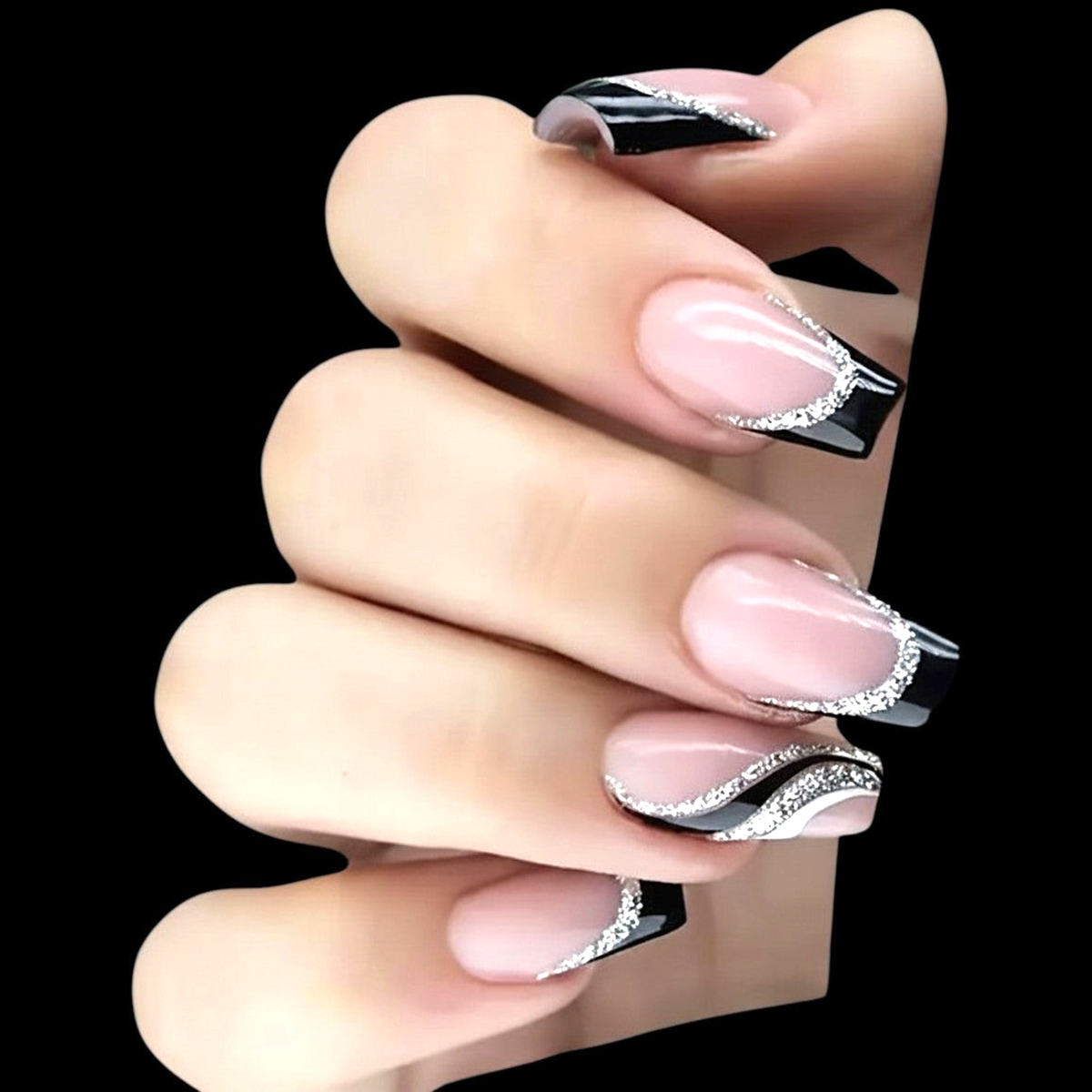 Snazzi Pink Shop medium coffin press-on nails with nude-pink base, black French tips, and silver glitter wave lines.