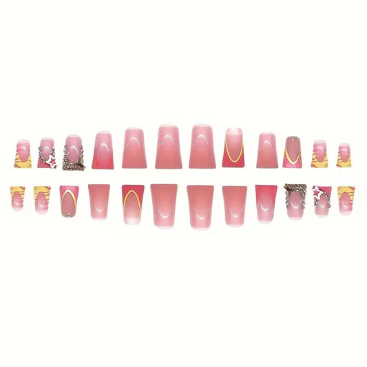 Snazzi Pink Shop long duckbill press-on nails with pink ombré, coral swirls, gold curves, and crystal star accents.