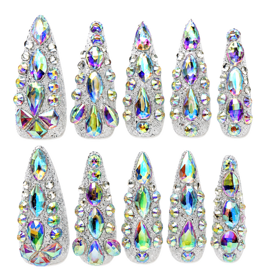 Snazzi Pink Shop Prism Majesty extra long stiletto nails with silver textured base and iridescent rainbow crystals.