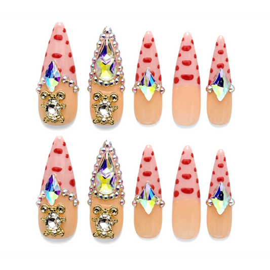 Snazzi Pink Shop Teddy Royale extra long stiletto nails with pink and nude base, teddy bear charms, and crystals.