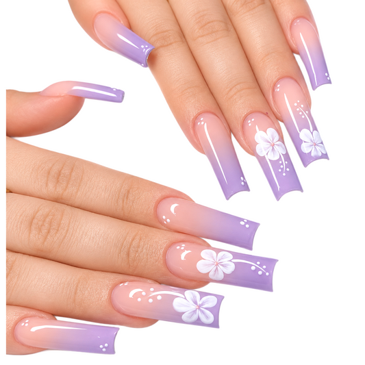 Snazzi Pink Shop extra-long coffin press-on nails with nude-to-violet ombre, white floral art, and glossy finish.
