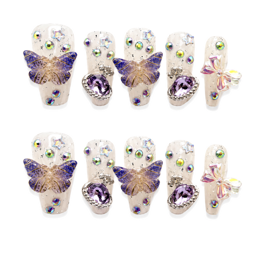 Snazzi Pink Shop Violet Treasure long coffin nails with violet butterflies, purple heart gems, and silver star accents.