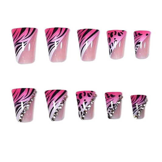 Snazzi Pink Shop Wild Pink medium duckbill press-on nails with hot pink zebra and leopard print and crystal accents.